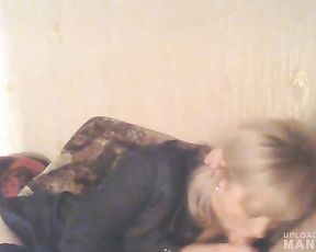 Mature lady giving head while watching TV
