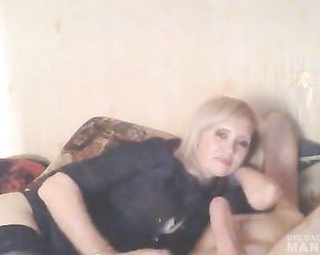 Mature lady giving head while watching TV