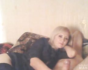 Mature lady giving head while watching TV