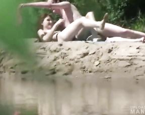 Pervert watching young couple fucking on the beach