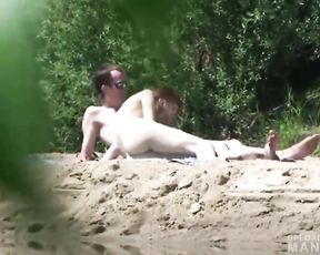 Pervert watching young couple fucking on the beach